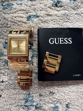 Guess Gold-Tone Ladies Bracelet Watch with Crystal Accents and Branded Links
